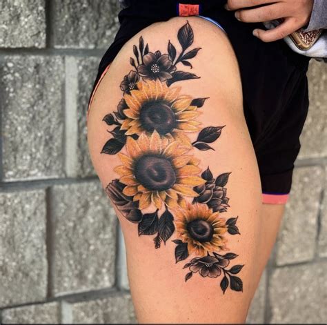 sunflower thigh tattoo|sunflower back tattoos for women.